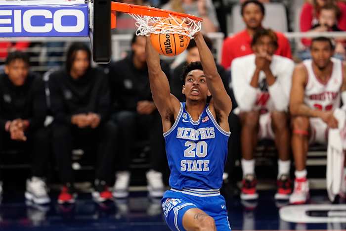 Memphis Tigers forward Josh Minott (20) dunks the ball against the Houston Cougars during the first half at Dickies Arena.